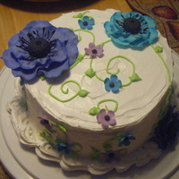 Lilia's Anemone Cake Coconut flavored WASC torted and filled with a vanilla/coconut mousse frosted with Wilton's whipped icing flavored with coconut....