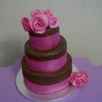 Chocolate Fudge Cake With Sugarpaste Roses Chocolate cake with a rich chocolate fudge icing topped with home made sugarpaste roses.