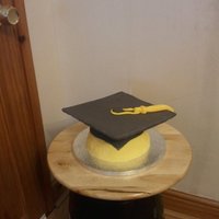 Graduation Moterboard Cake This is a pumpkin bread coated with cream cheese frosting and then covered with fondant to make the morterboard.