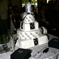 Black And White Square And Round This was a special request to have the bride and groom favorite candy (Snocaps) included in the cake. The bride was very helpful in...