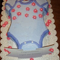 Onesie Sheet cake cut into onesie