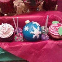 Gift Basket With Cupcakes, Cake Pops small gift basket containing chocolate peppermint, eggnog ornament, and gingerbread cupcakes, and spice and chocolate cake pops