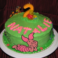 "pooh Birthday Cake" This is a 3 layer marble cake with buttercream frosting with royal icing transfers for the characters. They were my first attempt. They...