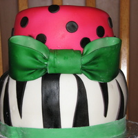 "party Animal" Birthday Cake 2 tier marble cake with BC and covered in MMF. All decorations are made with MMF and colored with an airbrush system.
