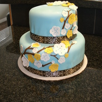 Cherry Blossoms On Light Blue Fondant - 2 Tiered Cake My 2nd attempt at cake decorating. How do you get the fondant not to crease on the side bottom edges? Anyways, the cake was a pound cake...