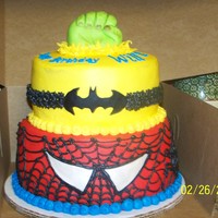 Super Hero Cake This was a spiderman, batman, incredible hulk cake. The bottom tiers are covered with buttercream, and used fondant accents. The hand is...