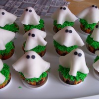Ghostly Cupcakes Cupcakes that were made for a Halloween Barn Party. Thanks to all the Cakescentral users for their wonderful ideas! these turned out...