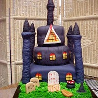 Halloween Castle Halloween Castle made for grandsons class party. Pound cake with vanilla filling. RKT for towers. Cotton candy not workable to shape webs...