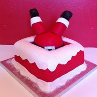 Santa In Chimney Christmas cake covered in marzipan and fondant. Santa made from marzipan.Thanks to lissyUK from this site for the idea.