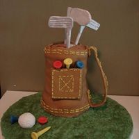 Golf Bag My first attempt with MMF (the bag and grass only) Tees/ball and clubs are fondant gum paste mix.