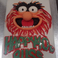 Animal From The Muppet Show Animal cake covered in a white MMF and decorated wildly!!