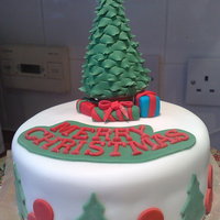 Tree And Presents! Rich fruit cake marzipan and fondant. Rest you can see! Made the tree by moulding the tree by snipping around the tree with scissors and...