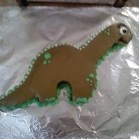 Dinosaur Cake WASC cake wit regular and chocoltae cream cheese icing. The eye is a candy melt and the spines are white chocolate chips. i got this design...