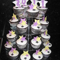 New Years Eve Cupcakes Chocolate mud and ganache cupcakes covered in fondant.