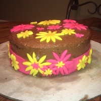 Birthday Cake chocolate fudge cake, with chocolate buttercream icing, and mint buttercream filling. Flowers made out of fondant.