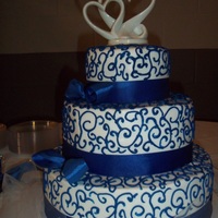 Royal Blue And White Wedding Cake 3 tiered white cake with buttercream icing, royal blue
