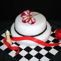Twilight Cake the cake is a madeira cake the apple, chess piece and the ribbon is made from cocoform the flower is made from flower paste and this was my...