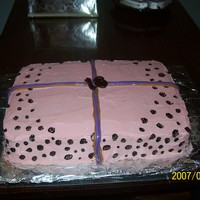 Sweet 16 triple layer black and white with buttercream, carmel and salt water taffy ribbion and chocolate 16. hand painted lepord spots