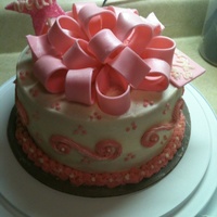 Cake With Fondant/gumpaste Bow Two layer orange cake with whipped vanilla cream/orange filling with buttercream icing. Bow is fondant/ gumpaste. (My second bow that I...