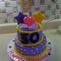 50Th Birthday Cake This ismy 5th cake. I made this for my sisters special 50th birthday. It is all buttercream, and the top (stars/hearts) are white chocolate...