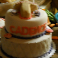 Cadences Christening my first fondant cake. 2 tier 10 in and 8in rainbow bit cake and buttercream. for my daughters christening