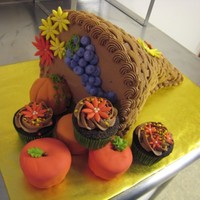 Thanksgiving Cornucopia Cake I learned how to spell cornucopia after making this cake for a friend's Thanksgiving dinner. The cake was two 8" cakes, filled...