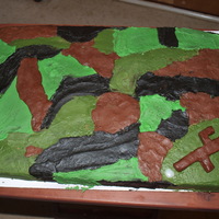 Camo Cake Camo inside and out! This was for a 10 year old boy. The little gun is a "marshmallow shooter gun" made from homemade chocolate...