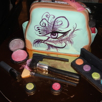 Makeup Artist Purse Cake This is red velvet cake. It was carved and covered in fondant. The make up pieces are made up of gumpase, and I hand painted the artist&#...