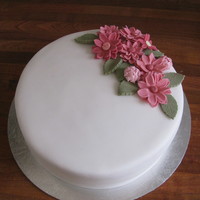 Flower Spray Pink Daisy Spray. Chocolate Cake with Bailey's Buttercream covered in white fondant