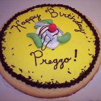 Happy Birthday Preggo Cookie Cake This is a giant sugar cookie iced in buttercream with fondant pickles, ice cream, anchovies, and buttercream chocolate drizzle. Mmmm, mmm...