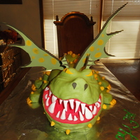 Gronckle: How To Train Your Dragon My son's 3rd birthday party cake. I used RKTs to carve his face, then covered in MMF.