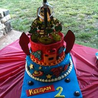 Toy Story Claw Cake Birthday cake for my 2 year old cousin, Keegan. The stars, rockets, planets, aliens, rocket boosters, and Buzz were made by chocolate...