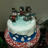 Peanuts Gang Ice Skating Snowscape Cake Birthday cake for my cousin. Tried a lot of different techniques in this cake. Covered in satin ice fondants with sculpted fondant snowmen...