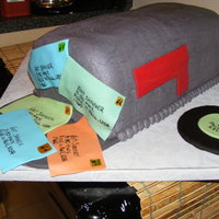 Mail Box Cake For A Dj/postal Worker Six 8 in square cakes stacked then iced in grey buttercream. Records and letters made out of fondant.