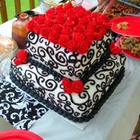 Black And White Wedding Shower Cake two tiered cake with black scroll work and red fondant roses
