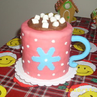 Mug Cake Christmas hot chocolate mug cake for my young daughters` pioneer class. It`s a yellow cake with chocolate buttercream frosting. covered in...
