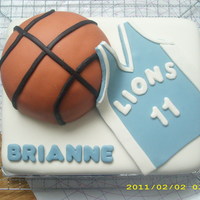Basketball Cake 9x13 marble cake, covered in MMF. Basketball is marble cake, jersey is MMF. Made for my cousins 15th bday. TFL