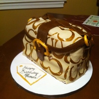 Coach Purse Cake Yellow cake with chocolate fudge buttercream