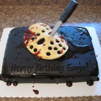 Friday The 13Th Jason Voorhees Cake Red Velvet Cream Cheese Cake covered in Black Fondant with Fondant/Gum paste mask and knife with Strawberry Jelly Blood