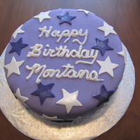 Purple And White Stars Birthday Cake Purple fondant covered in purple and white stars coated in pearl lustre.