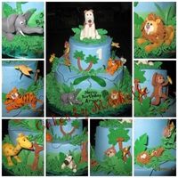 Jungle Cake Chocolate fudge cake with vanilla buttercream frosting. Gumpaste animals and trees.