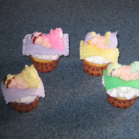 Fondant Baby Girl Cupcakes I made these cupcakes for a friends baby shower. The toppers are made out of fondant and are totally edible, although I'm not sure I...