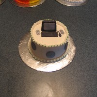 Computer Teacher Cake I made this small cake as a Christmas present for my daughters' computer teacher. It has fondant accents.