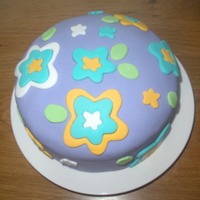 First Fondant Cake This was my first fondant cake! After playing around with fondant for a while I was dying to actually have a go on a cake. Very simple...