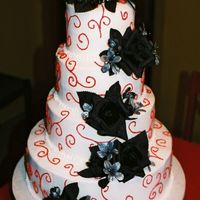 Red Swirls With Black Roses all chocolate cake with bc icing and red swirls and black roses
