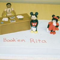 Poor Mickey this was for a co worker wholoves mickey mouse and is leaving our office to work at the sherriff's station. vanilla cake with mmf...