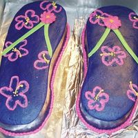 Purple Flip-Flops Yes one is bigger!!! This was just a for fun cake for my group at work, so no one cared. I just wanted the practice. The icing turned...