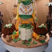 Scarecrow With Pumpkins Scarecrow is made out of rice krispies and covered with fondant. The two mini pumpkins on the side are pumpkin spice cake with honey cream...
