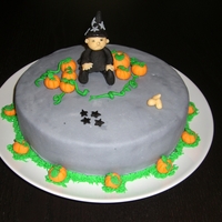 My First Cake This is actually my first cake with fondant. It is a banana cake with chokolate cream. The wizard on top was supposed to be a witch but it...