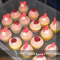 More Mini Cupcakes wasc cupcakes with rasberry buttercream. fondant accents and fresh rasberries. thanks for looking.